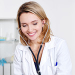 Blonde Woman Doctor using Stethoscope